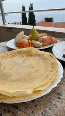 Breakfast spread documented on balcony table Sunday morning