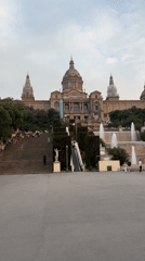 Evening crowd gathers at Barcelona museum fountains for photos, performances