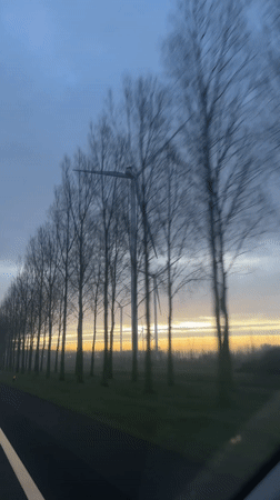 Morning commute captures wind turbines at sunrise near Deil