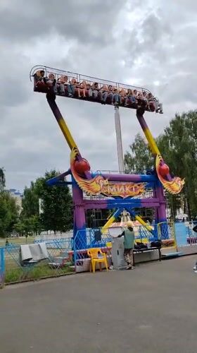 Amusement park activities documented in Brest, Belarus during afternoon hours