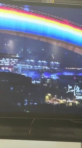 Shanghai commuters share bench, phones at subway station
