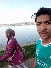 Man films selfie video lakeside in Lhokseumawe