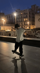 Skateboarding through Barcelona streets at dusk