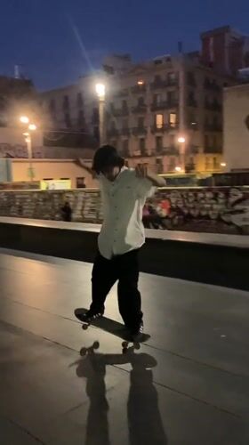Skateboarding through Barcelona streets at dusk