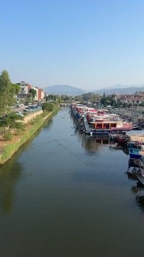 Quiet canal with boats and ducks, Fethiye, Turkey