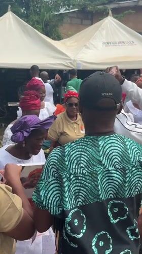 Community celebration with music and money distribution in Eziudo, Nigeria