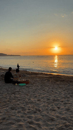 Families gather for sunset moments at Kuta Selatan beach