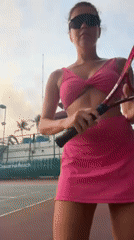 Woman plays tennis at midnight in Choeng Thale, Thailand