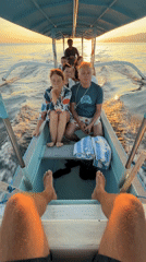 Group travels by narrow boat in Banjar, Indonesia