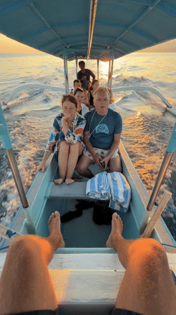Group travels by narrow boat in Banjar, Indonesia