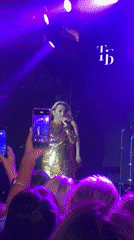 Live stage performance under purple lights in Estosadok, Russia