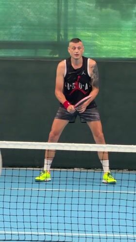 Pickleball game in progress at indoor court in Nha Trang