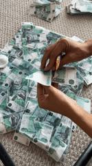 Person processes Russian banknotes with tools in Krasnoyarsk residence