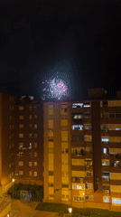 Fireworks light up night sky over Badalona apartment building