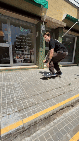 Skateboarder performs tricks on rails and ramps in Terrassa