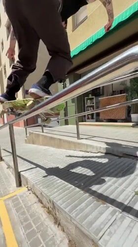 Skateboarder performs tricks on rails and ramps in Terrassa