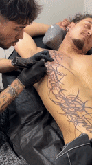 Extensive black tattoo session underway at a Sofia studio.
