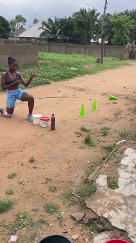 Woman conducts rope throwing exercise routine in Akwanga