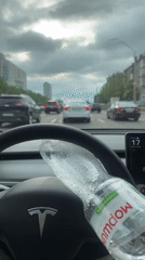 Tesla drives through Kyiv streets on overcast afternoon