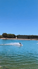 Leisure activities captured in Castelldefels: wakeboarding and waterside gathering