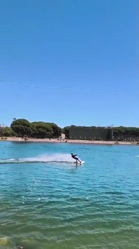 Leisure activities captured in Castelldefels: wakeboarding and waterside gathering