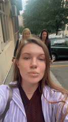 Three women film themselves walking through Belgrade streets