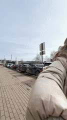 Woman pushes baby stroller on morning walk in Khimki