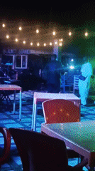 Nighttime band performance at decorated outdoor venue in Katambe