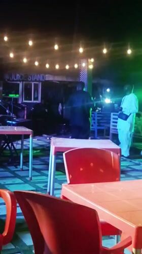 Nighttime band performance at decorated outdoor venue in Katambe