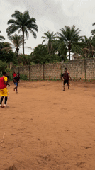 Soccer game played on dirt field in Nkpor
