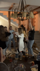 Casual indoor party with dancing and snacks in rural Russia
