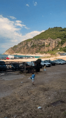 Abandoned concrete ruins overlooking a turquoise Montenegrin cove