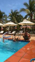 Father supervises children's pool play in Phu Thuy Ward