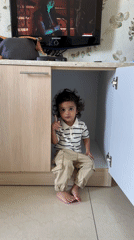 Child found sitting in cupboard under television in India