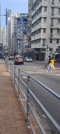 Early morning street life across a Hong Kong neighborhood