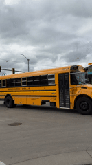 School bus stops at Wisconsin Dells intersection, door open