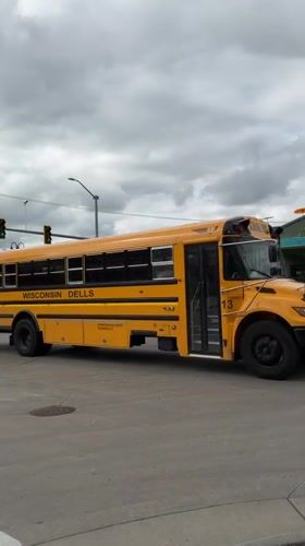 School bus stops at Wisconsin Dells intersection, door open