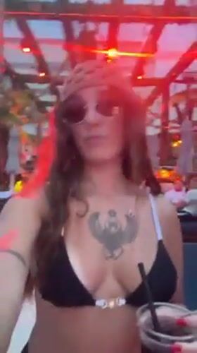Young tourists enjoy poolside party at Bali resort
