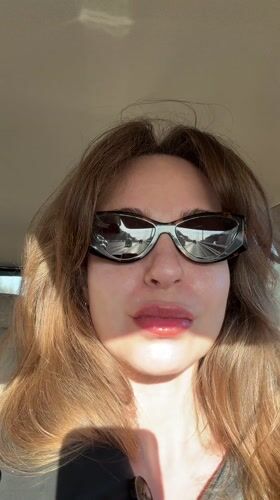 Woman in sunglasses observed in vehicle in Vnukovo
