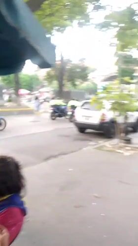 Caracas residents document routine mall visits, chess tournament, police activity