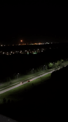 Nighttime scenes captured in Kazan show traffic, moon over waterfront