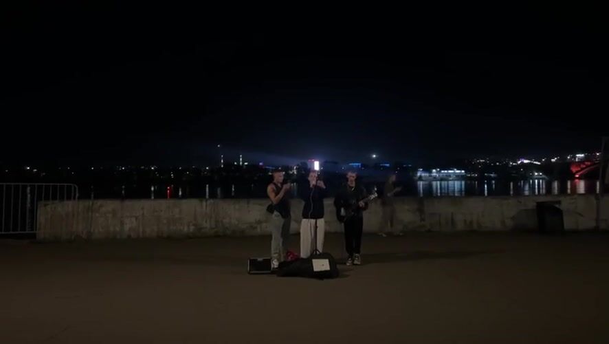 Live street performance outside Krasnoyarsk Railway Station at night