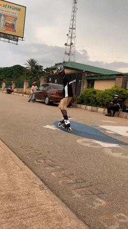 Inline skaters practice obstacle course training on Jos street