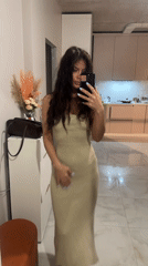 Woman takes selfies in different outfits in Khimki
