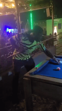 Nighttime pool game captured in Gura Top, Nigeria