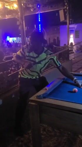 Nighttime pool game captured in Gura Top, Nigeria