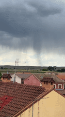 Rural Spanish town documented under cloudy afternoon sky