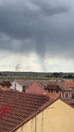 Rural Spanish town documented under cloudy afternoon sky