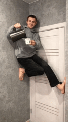 Man performs gravity-defying door stunt while pouring water in Krasnodar