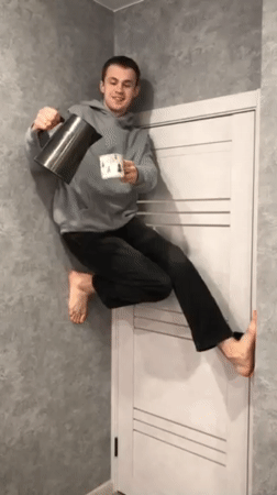 Man performs gravity-defying door stunt while pouring water in Krasnodar